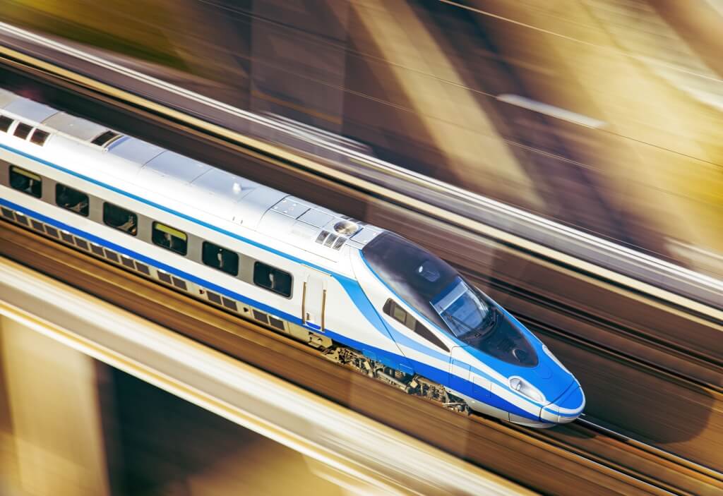 Blue high-speed train on a bridge